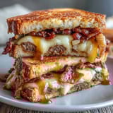 1. Hot Honey Apple Cheddar Beef Bacon Grilled Cheese with crispy beef bacon and tart apple slices on golden sourdough.  