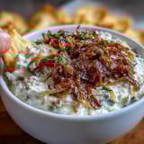 Rich, tangy caramelized onion dip made with Greek yogurt, perfect for dipping fresh vegetable sticks or crackers.  