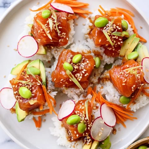 Delectable poke bowl showcasing bright colors and textures of fish, rice, nori, and toppings, a satisfying meal.