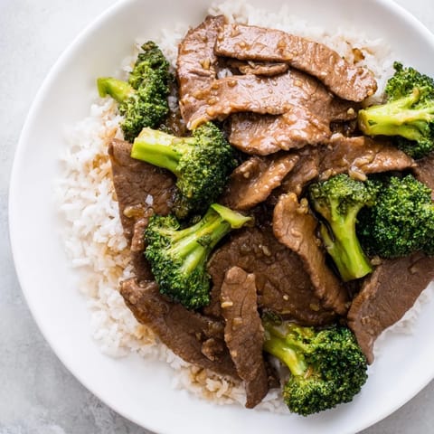 Savory Beef and Broccoli stir-fry: hearty beef and vegetables glistening in a rich, dark sauce.
