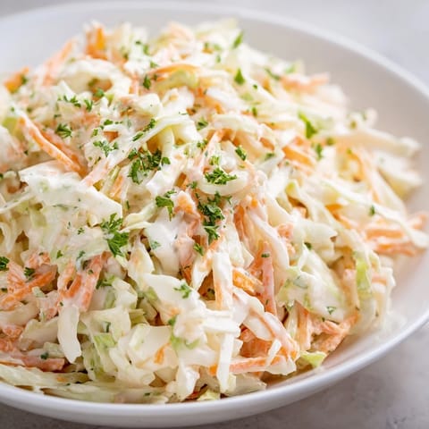 Homemade Coleslaw with Apple, a vibrant veggie salad with a sweet and tangy apple flavor, ready to eat.