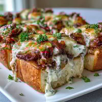 Warm Derby Party Hot Brown Sliders on brioche buns with turkey, bacon, and creamy Mornay sauce, perfect for Southern gatherings.  